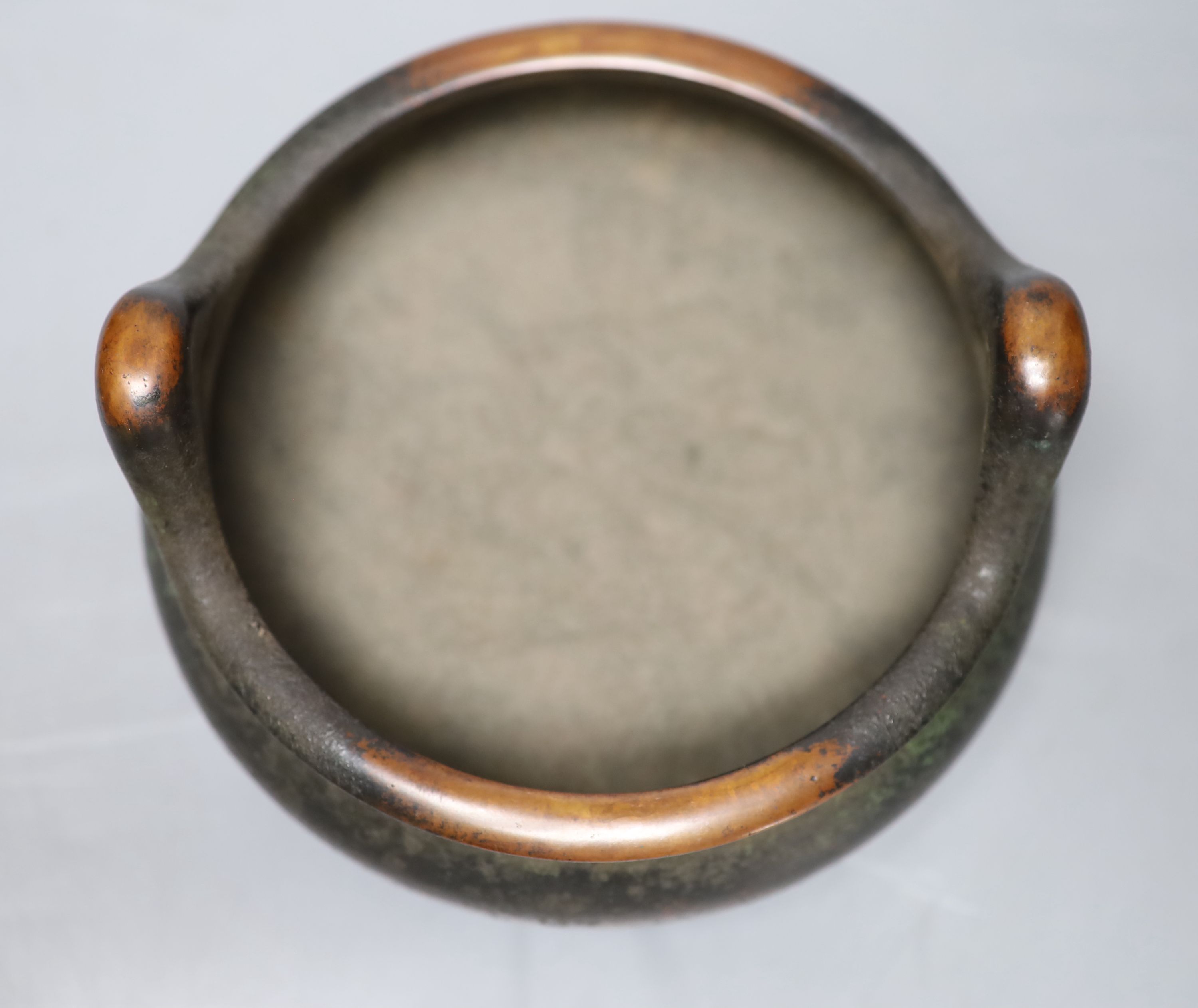 A Chinese bronze tripod censer, diameter 27cm height 10cm